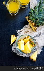 fresh juice and pineapple on a table