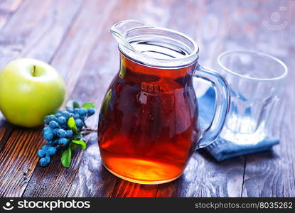 fresh juice in glass and on a table