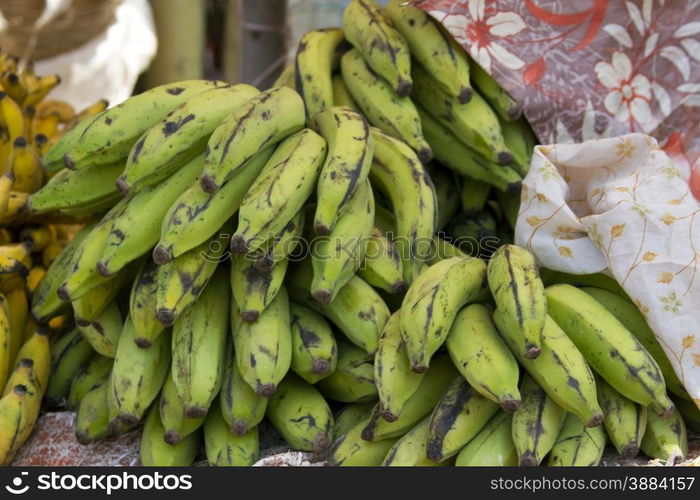 Fresh juicy bananas on a counter in the market of India of Goa. Fresh juicy bananas on a counter in the market of India of Goa.