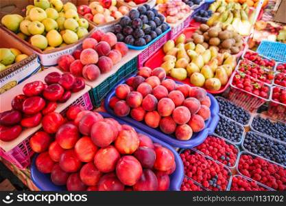Fresh, juicy fruits at a market under the open sky