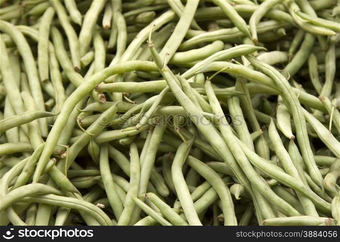 Fresh juicy green beans on a counter in the market of India of Goa. Fresh juicy green beans on a counter in the market of India of Goa.