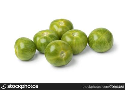 Fresh juicy green striped tomatoes close up isolated on white background