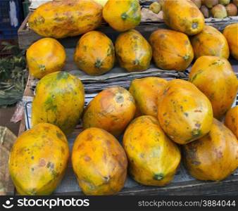 Fresh juicy papaya on the counter in India Goa. Papaya at fruits wholesale market place