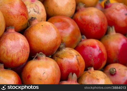 Fresh juicy pomegranate on a counter in the market of India of Goa. Fresh juicy pomegranate on a counter in the market of India of Goa.