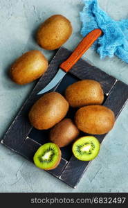 fresh kiwi on a table, kiwi on blackboard