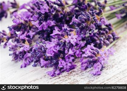 Fresh lavender on the white shabby wooden table
