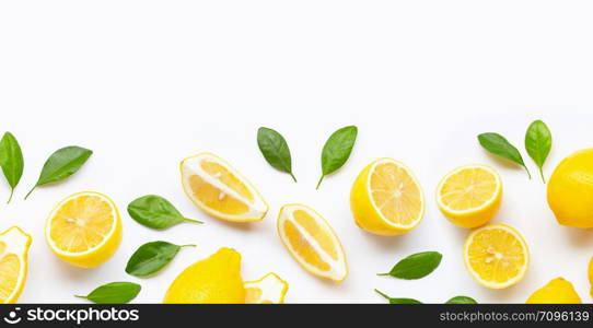 Fresh lemon and slices with leaves isolated on white background.