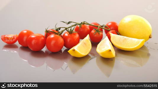 fresh lemon and tomato fruit isolated on white