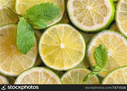 Fresh Lemon slices background and mint leaves