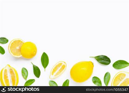 Fresh lemon with green leaves on white background.