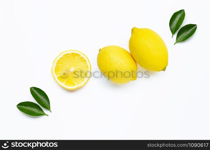 Fresh lemon with green leaves on white background.