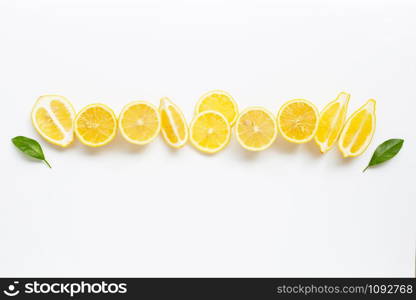 Fresh lemon with green leaves on white background.