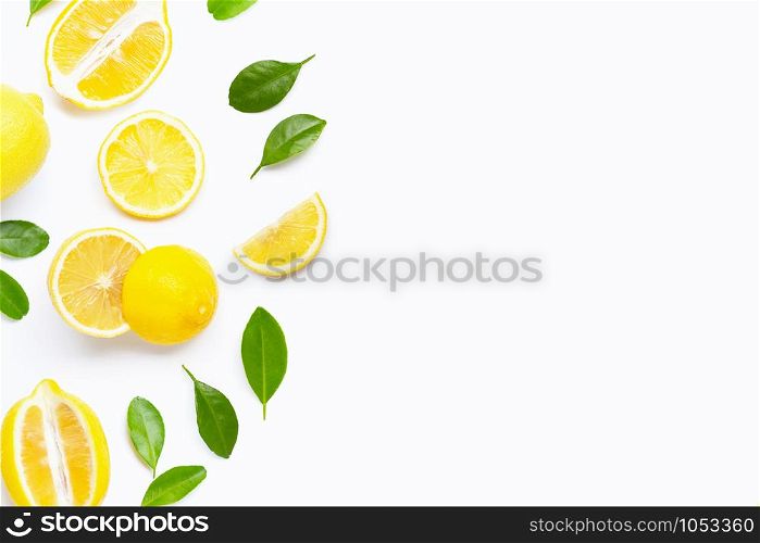 Fresh lemon with green leaves on white background. Copy space