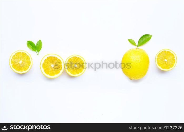 Fresh lemon with green leaves on white background. Copy space for text or product