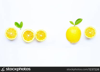 Fresh lemon with green leaves on white background. Copy space for text or product