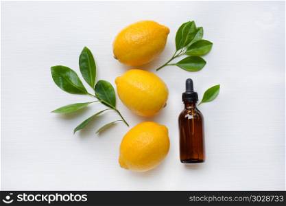 Fresh lemon with lemon essential oil .. Fresh lemon with lemon essential oil on a white background.