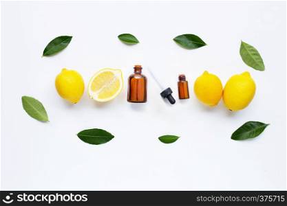 Fresh lemon with lemon essential oil on a white background.