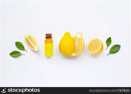 Fresh lemon with lemon essential oil on white background
