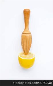 Fresh lemon with wooden juicer on white background. Top view