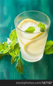 fresh lemonade drink with mint in glasses