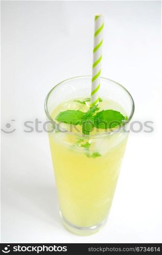 Fresh lemonade in glass with mint leaf