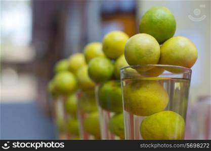 Fresh lemons arranged in glass at store
