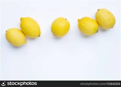 Fresh lemons on white background. Copy space