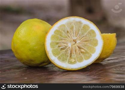 Fresh lemons on wooden background, Selective focus.