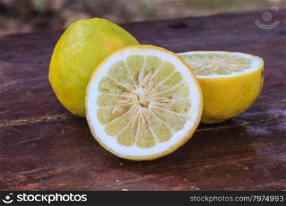 Fresh lemons on wooden background, Selective focus.
