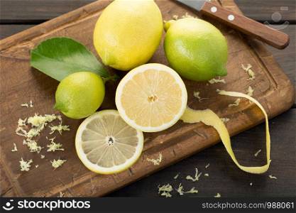 Fresh lemons on wooden cutting board