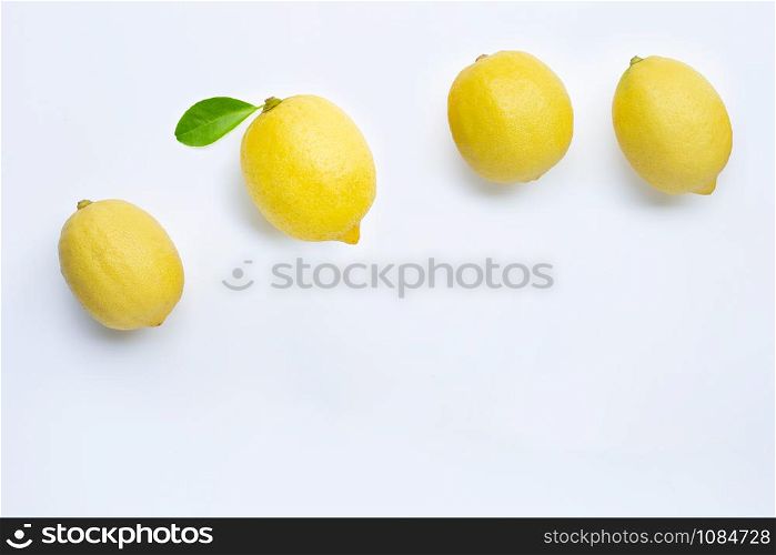 Fresh lemons with green leaf on white background. Copy space