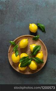Fresh lemons with leaves, summer citrus lemonade ingredient