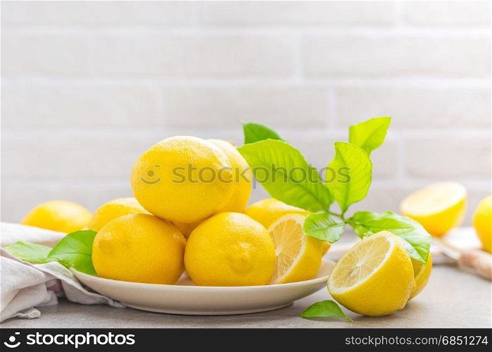 Fresh lemons with lemon leaves