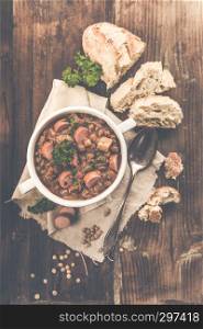 fresh lentil stew with sausages and parsley