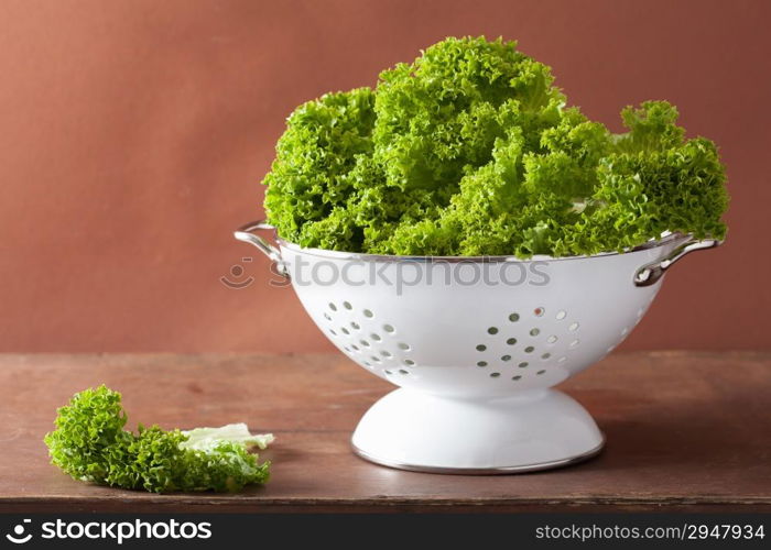 fresh lettuce leaves in colander