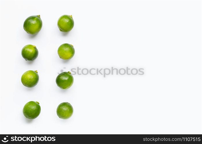 Fresh limes isolated on white background. Copy space