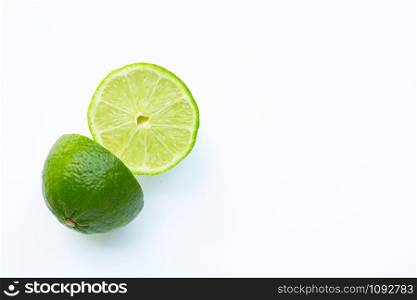 Fresh limes on white background. Copy space