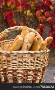 Fresh loaf bread on the basket in autumn
