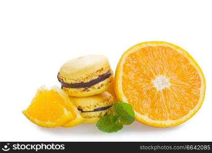 Fresh macaroons with orange isolated over white background