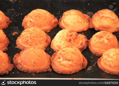 Fresh made luxurious cookies on display on a market scale