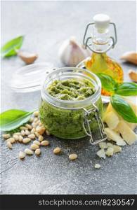 Fresh made Pesto sauce. Green basil pesto.  Ingredient for pesto sauce - Fresh Basil, Pine Nuts, Olive Oil and Cheese