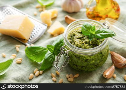 Fresh made Pesto sauce. Green basil pesto.  Ingredient for pesto sauce - Fresh Basil, Pine Nuts, Olive Oil and Cheese