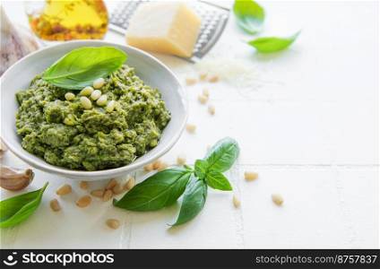 Fresh made Pesto sauce. Green basil pesto.  Ingredient for pesto sauce - Fresh Basil, Pine Nuts, Olive Oil and Cheese