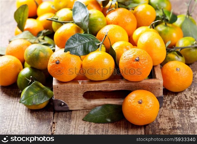 fresh mandarin oranges fruit in wooden box