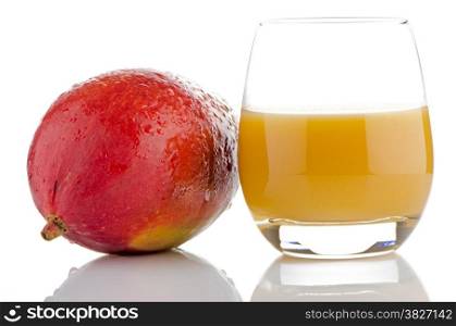 Fresh mango juice and mango fruit on white reflective background.