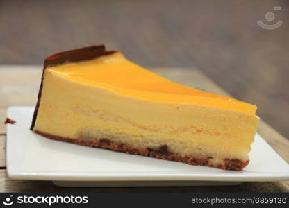 Fresh mango peach mousse confectionery, with soft cake bottom