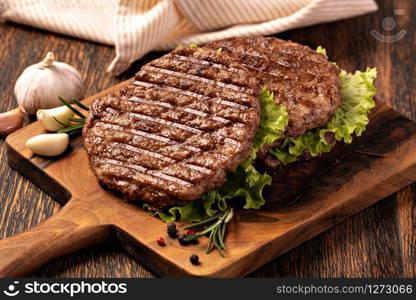 Fresh meat cutlets on wooden background. Fresh meat cutlets