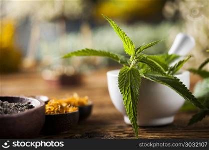 Fresh medicinal, healing herbs on wooden . Natural medicine on wooden table background
