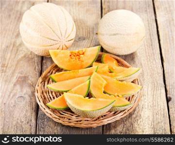 fresh melon on wooden table