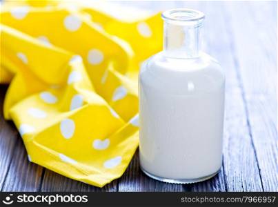 fresh milk in bottle and on a table
